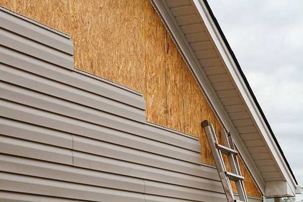 Professional Storm Damage Siding Repair technician working in Westbury, NY